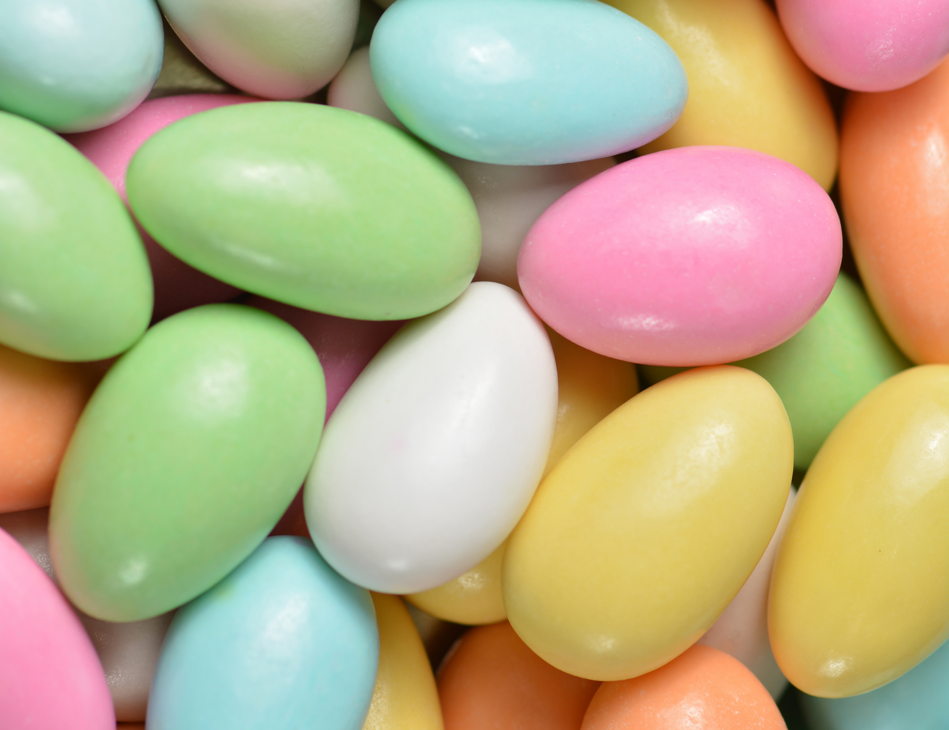 : "Assorted Jordan Almonds in pastel colors, a traditional confectionery featuring candy-coated California almonds, perfect for weddings, parties, and celebrations."