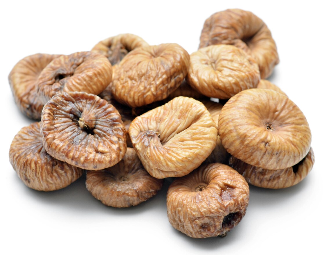 "A close-up of plump and tender dried figs, a delicious and nutritious snack with a rich, sweet flavor spread out